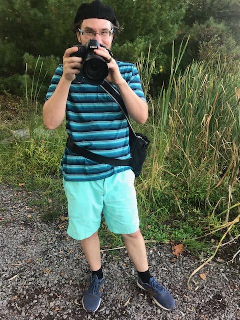 David holding a camera